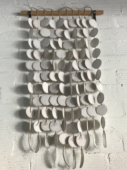 PLT10 mquan porcelain -stoneware feather sculpture with white oak dowel and raw steel brackets