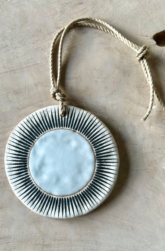 Sun white stoneware ornament by Mquan