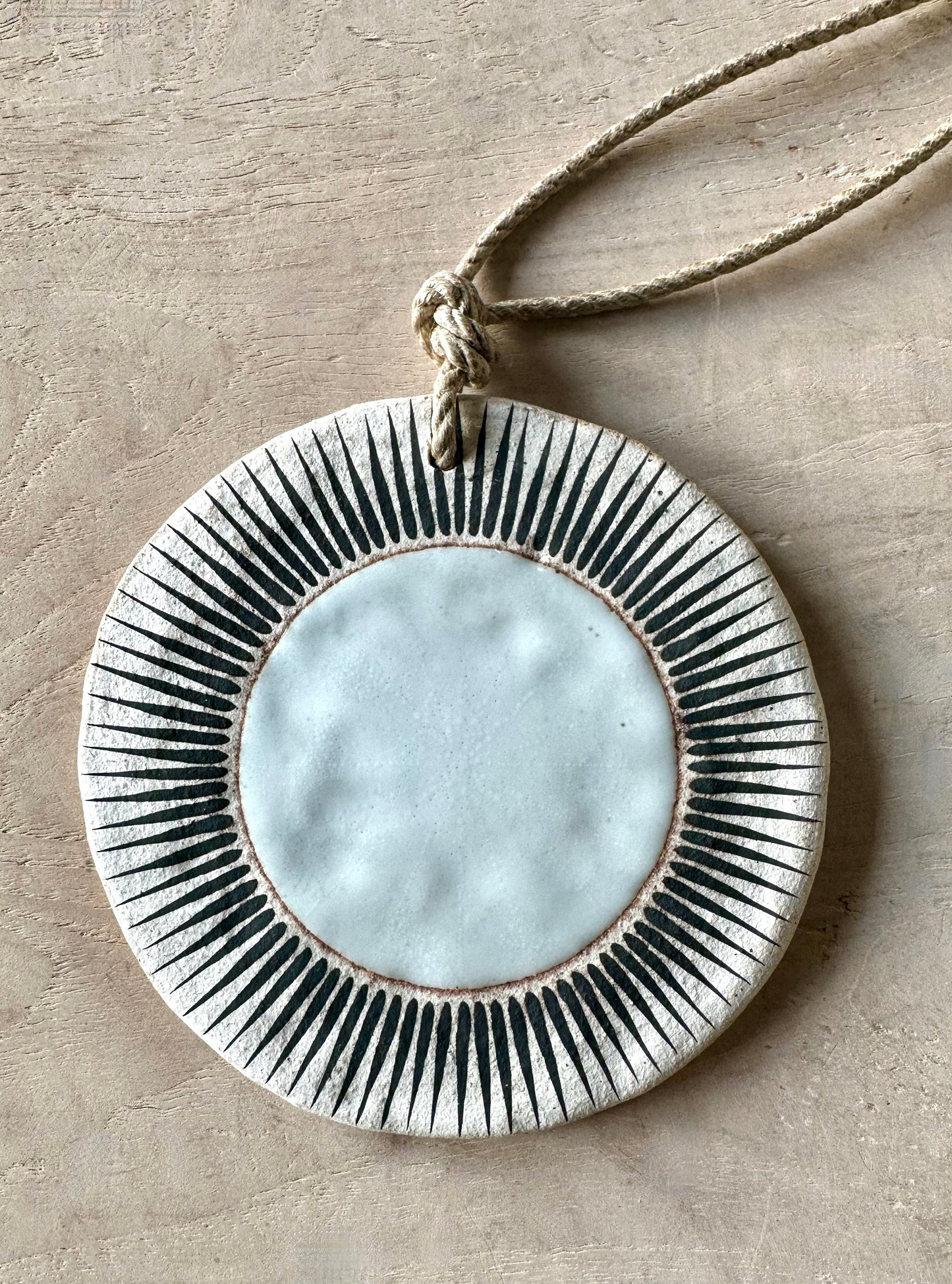 Sun white stoneware ornament by Mquan