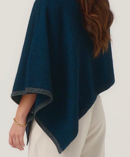 cropped cape poncho from new zealand in deep teal and charcoal trim